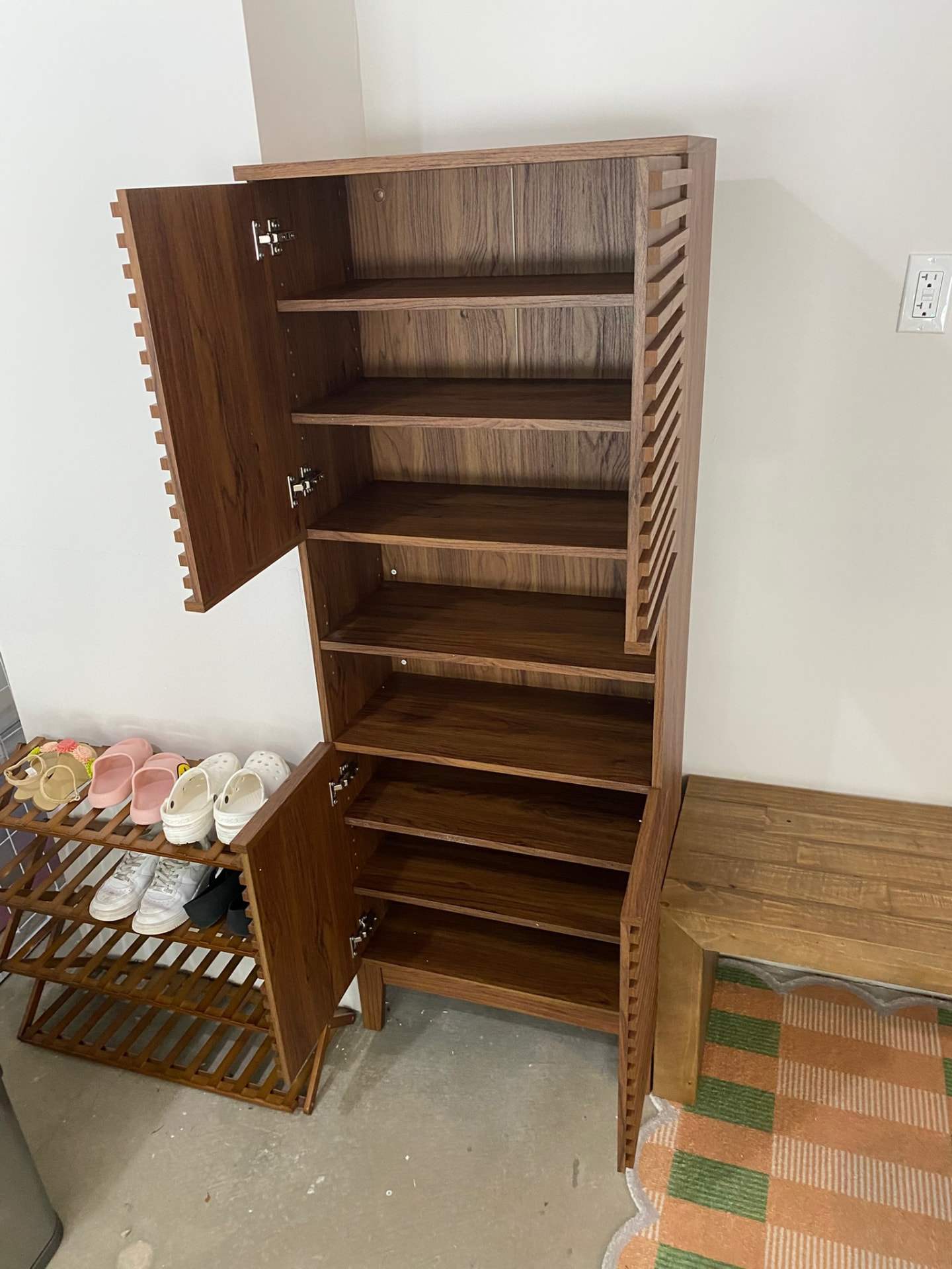 Completed tall wood storage cabinet with doors and adjustable shelves