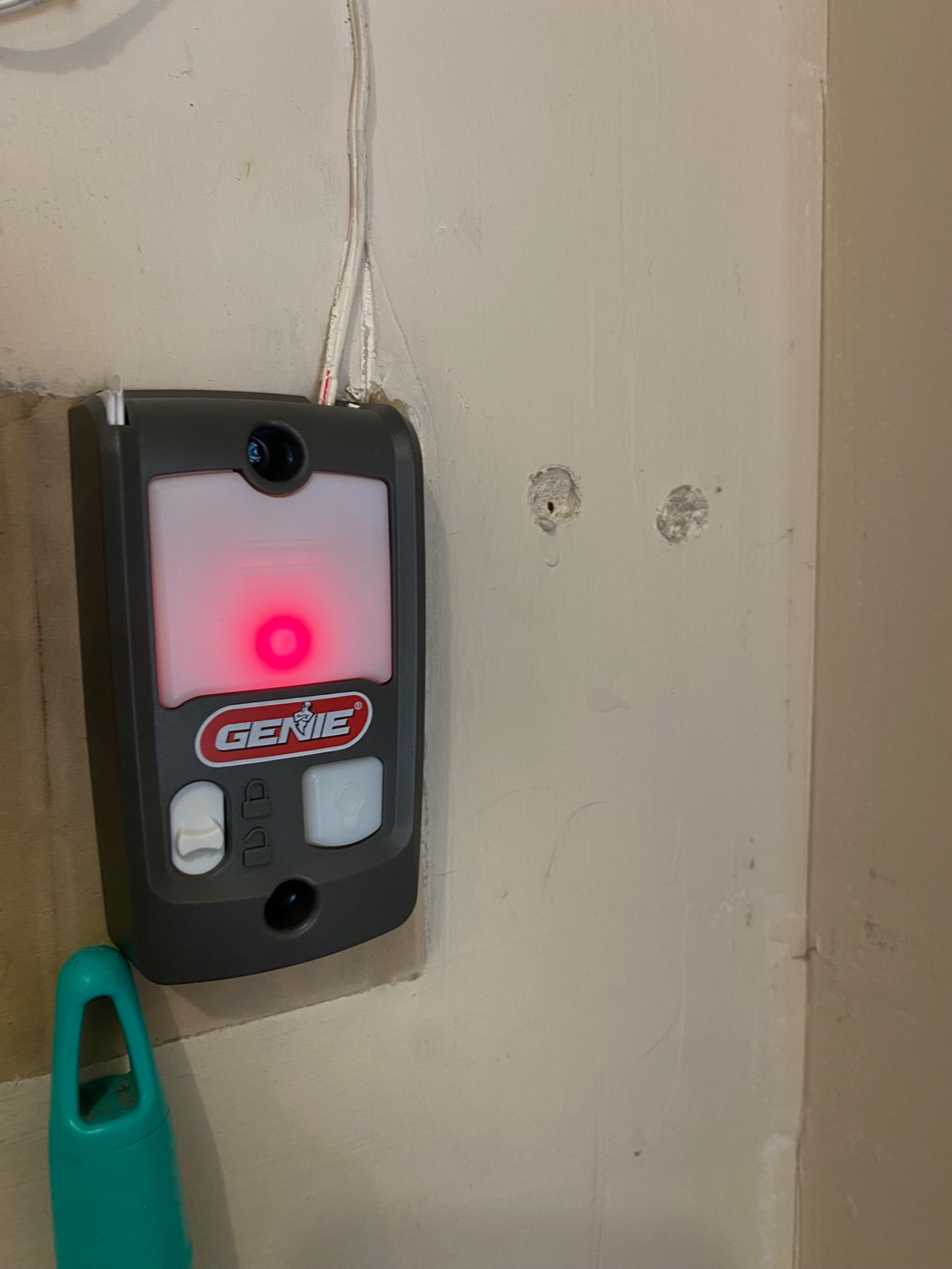 Wall-mounted Genie garage door control installed and powered