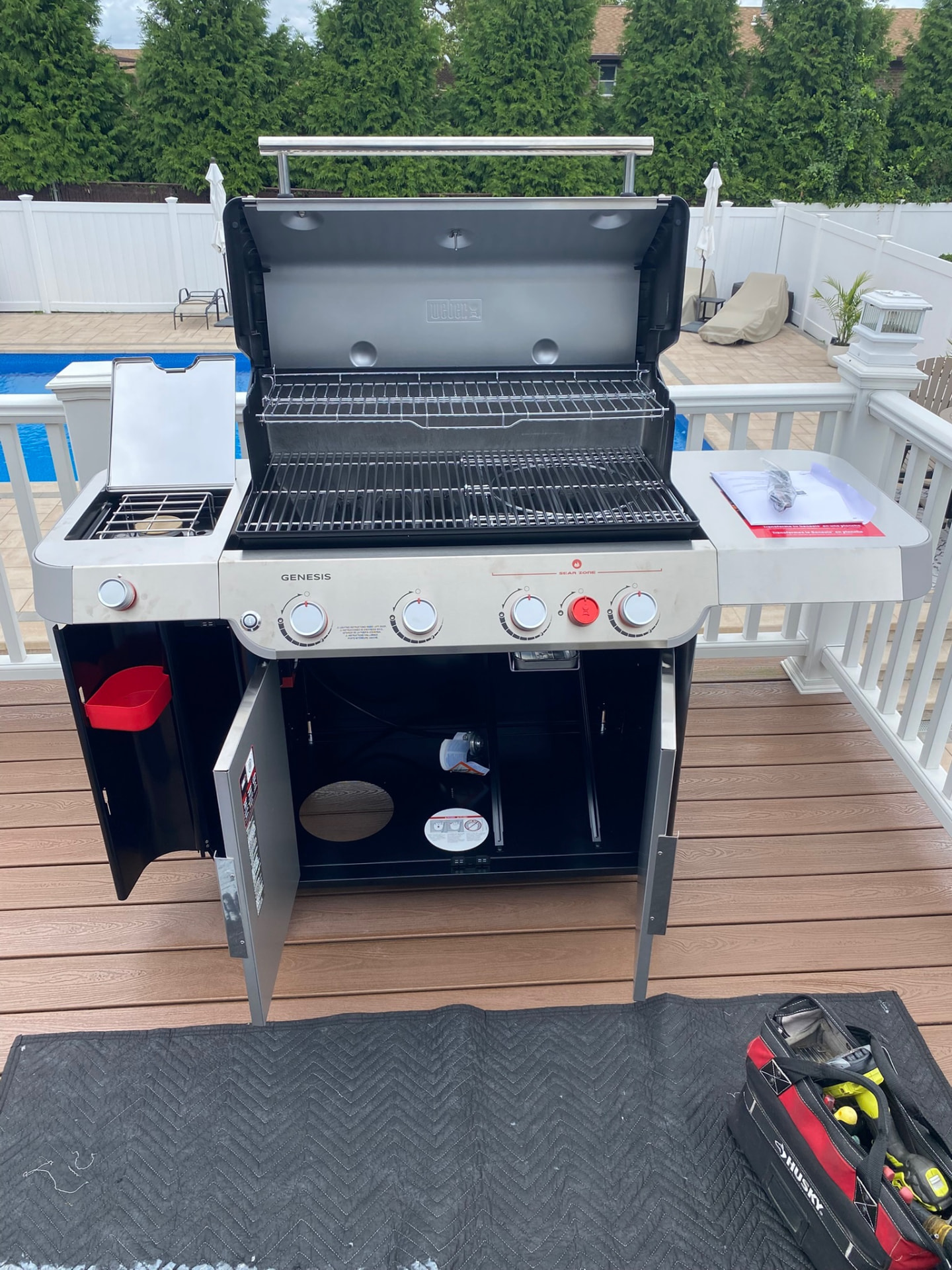 Completed Weber Genesis grill assembled on a backyard deck