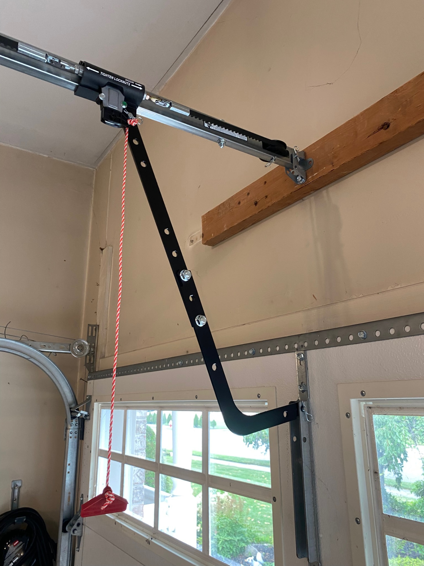 Garage door track and support hardware installed overhead